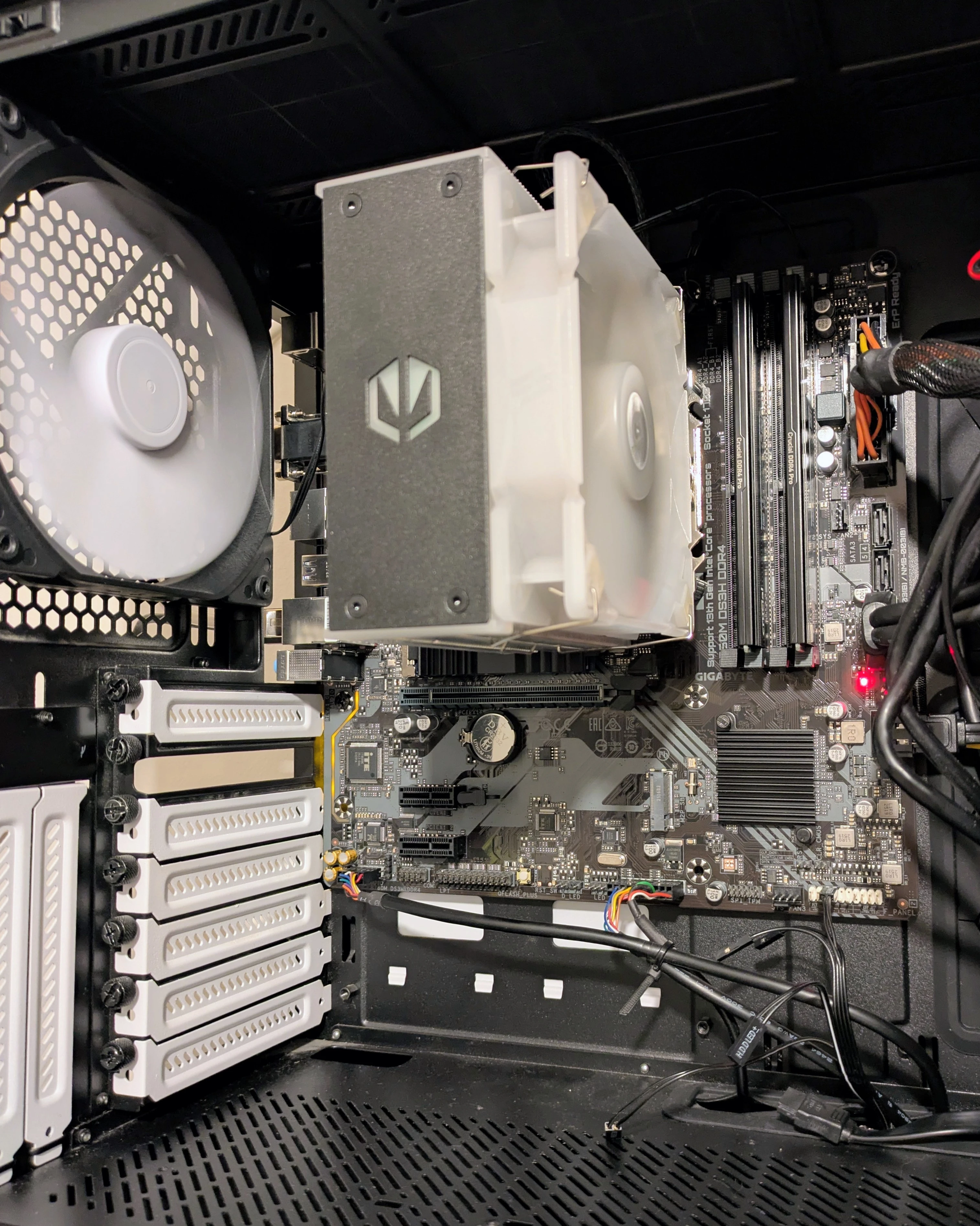 Inside the server's open tower case, showing the CPU cooler, two RAM modules, and motherboard.